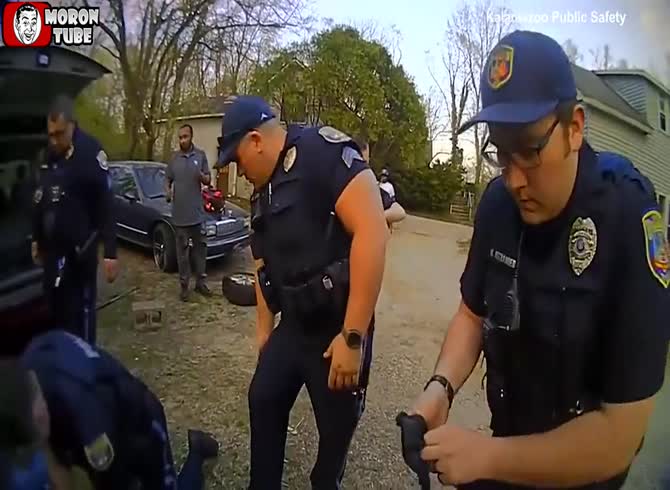 Video :A guy stranded beneath a car is rescued by police